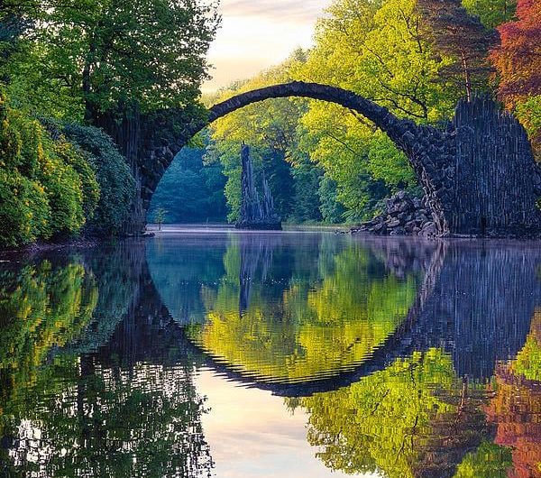 Perfect reflection of the Rakotz bridge in Kromlau, Saxony, Germany