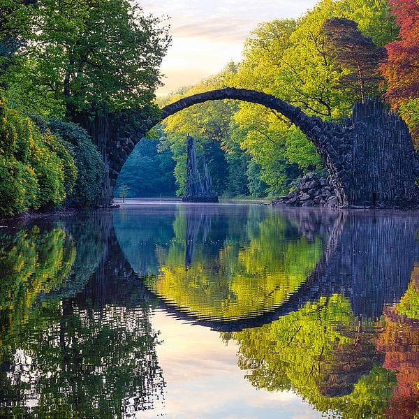 Perfect reflection of the Rakotz bridge in Kromlau, Saxony, Germany