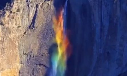 Photographer Greg Harlow captured a rare natural scene at Yosemite Falls, where high winds and sunlight refract through the mist to form a rainbow waterfall
