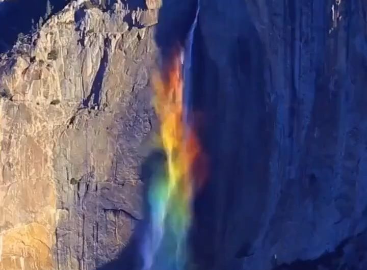 Photographer Greg Harlow captured a rare natural scene at Yosemite Falls, where high winds and sunlight refract through the mist to form a rainbow waterfall