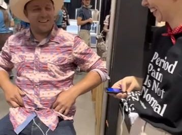 Placing a period pain simulator on a cowboy