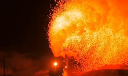 Real steam at night — JS-class locomotive in Sandaoling, China, showering sparks during a firebox clean
