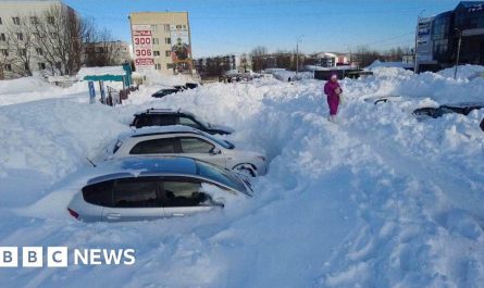 Record snowfall leaves cars stuck and people stranded in Russia's Far East