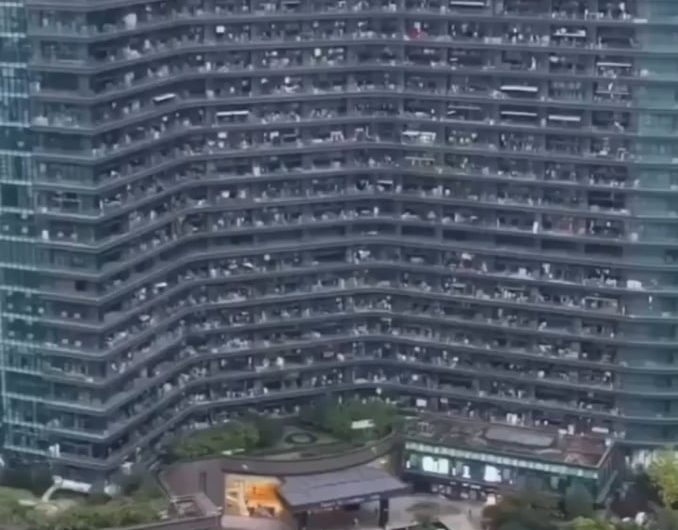 Regent International apartment building in Zhejiang with an estimated 21,000 residents and 39 floors with facilities like a food court, multiple swimming pools, grocery stores, barbershops, nail salons, and cafes etc