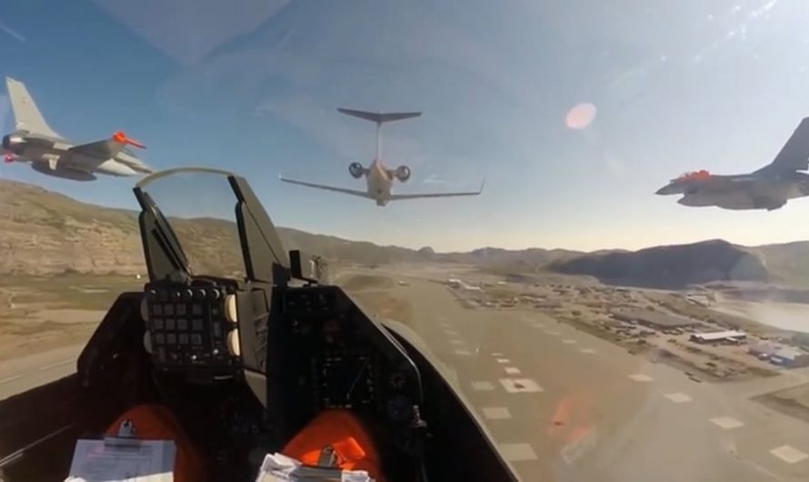 Royal Danish Air Force F-16s on low-level flight over Greenland, overflying a Danish Navy vessel and radar station