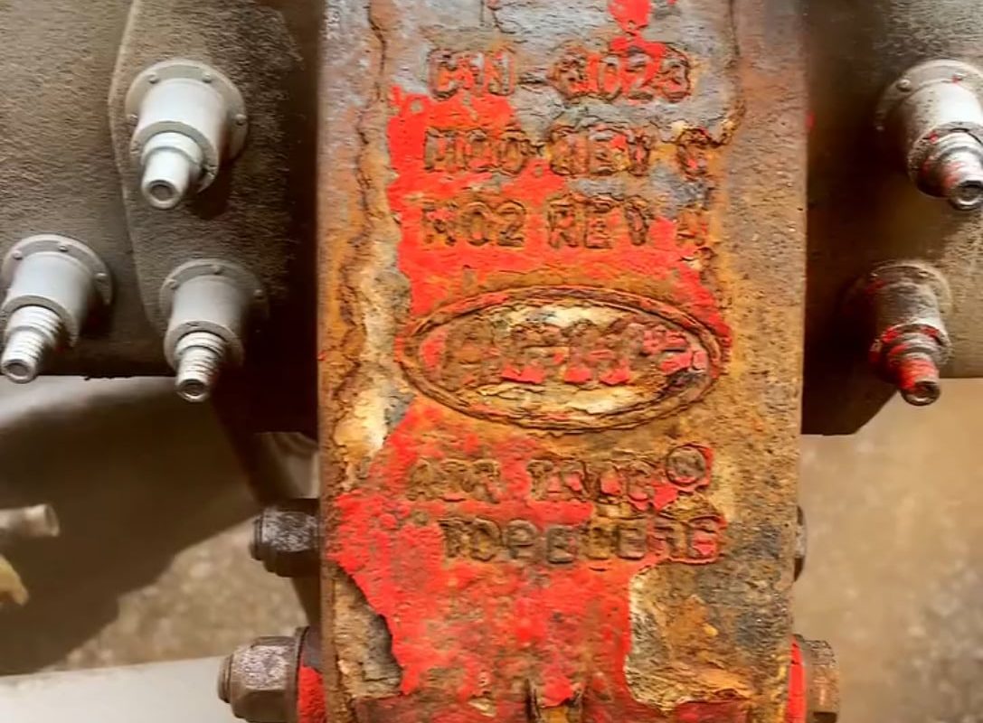 Rust being removed by sandblasting