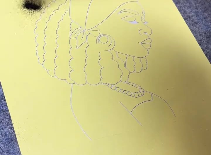 Sand-painting or glitter painting of a woman