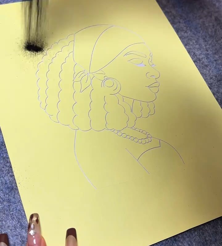 Sand-painting or glitter painting of a woman