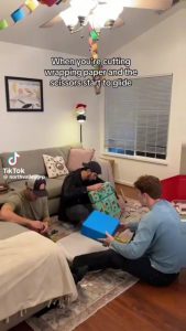 Scissors slicing to wrapping paper