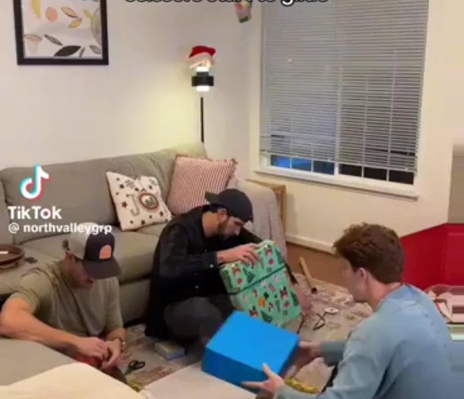 Scissors slicing to wrapping paper