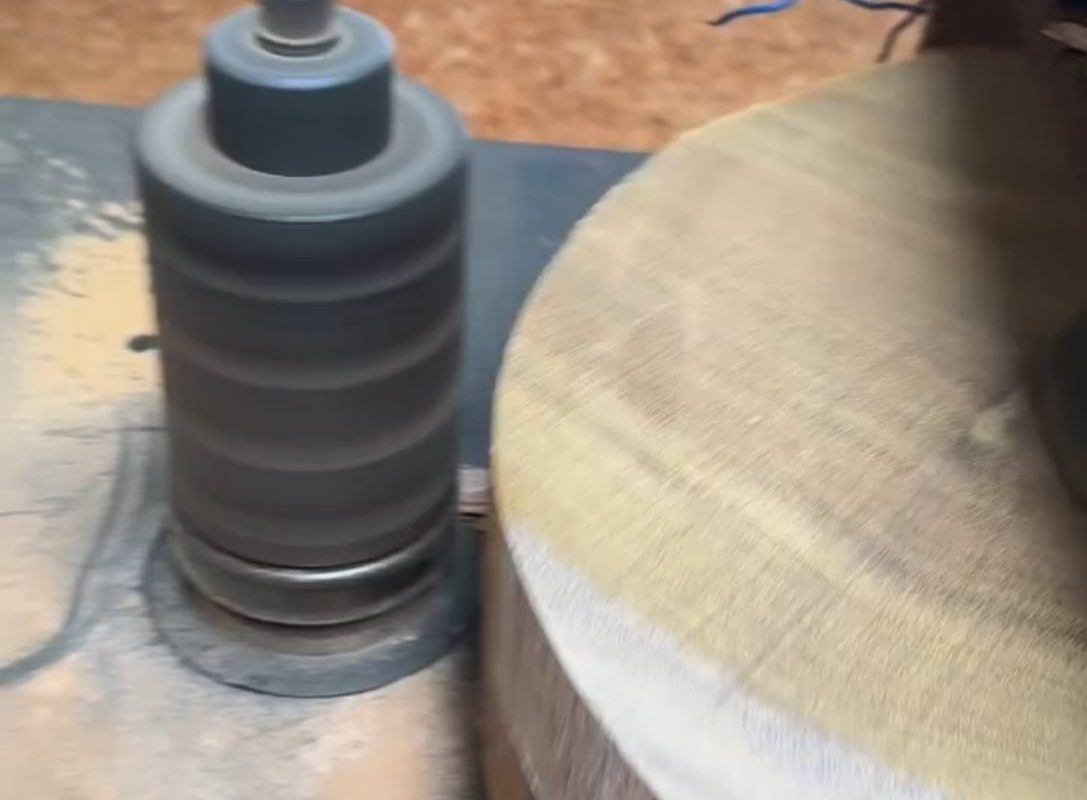 Shaping a wooden disc on a lathe