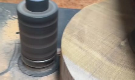 Shaping a wooden disc on a lathe