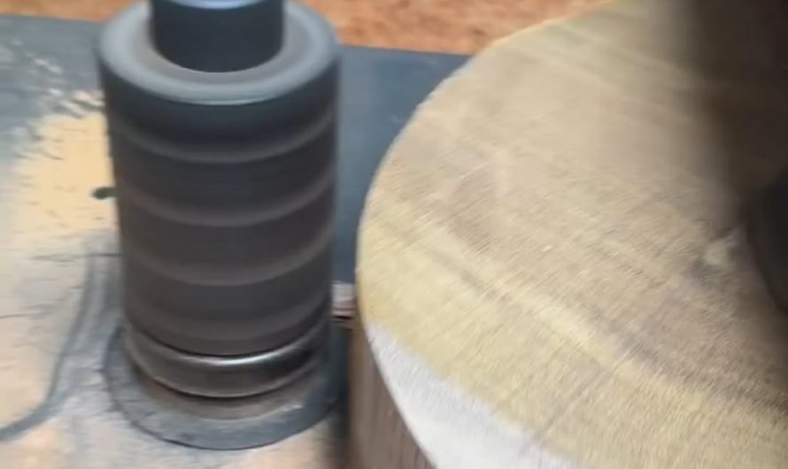 Shaping a wooden disc on a lathe