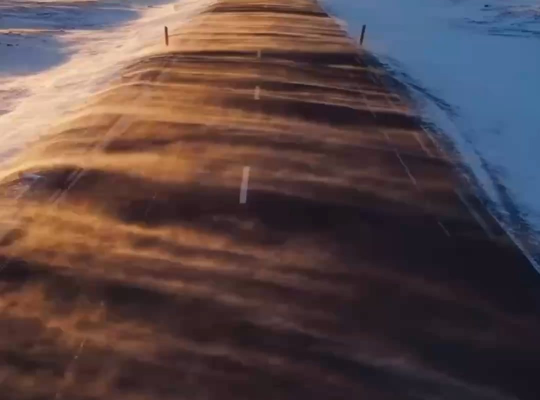 Snow blowing across a road in Iceland