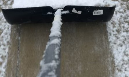 Snow piling up on the shovel