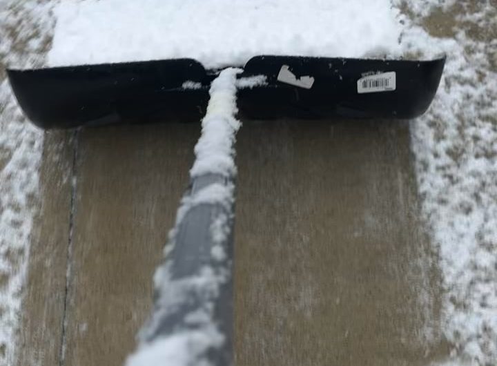 Snow piling up on the shovel
