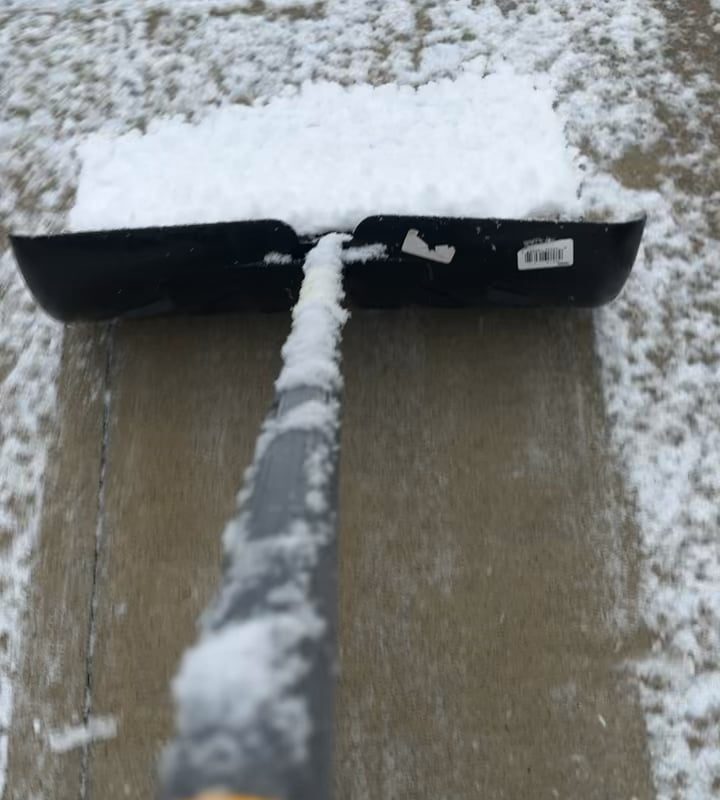 Snow piling up on the shovel
