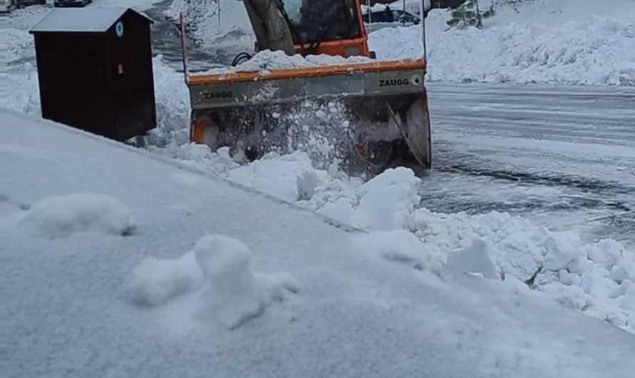 Snowplow clearing driveway