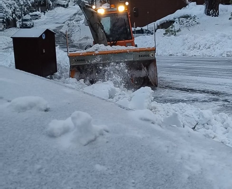 Snowplow clearing driveway