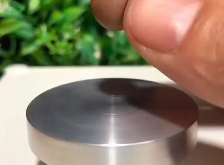 The calm precision of making miniature pottery.