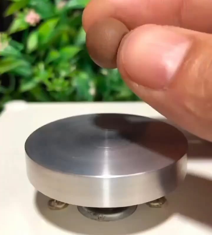 The calm precision of making miniature pottery.