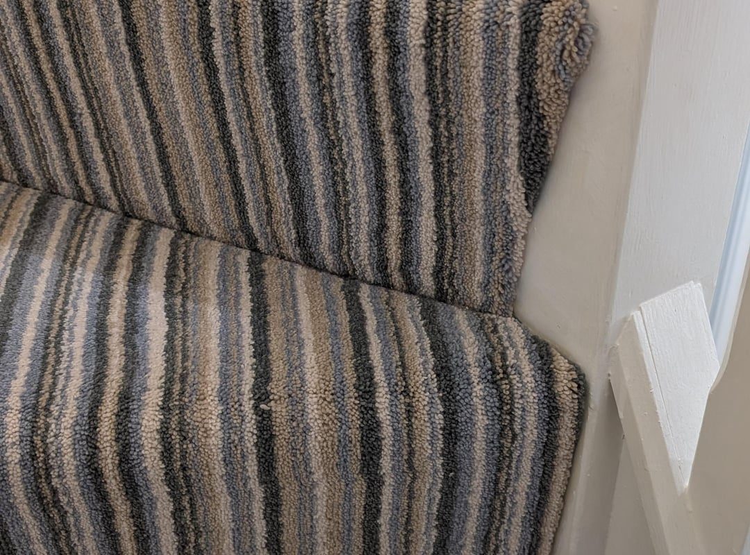 The way they fitted the carpet on our semi-spiral stairs