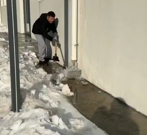 This Removing of Ice From a Downspout