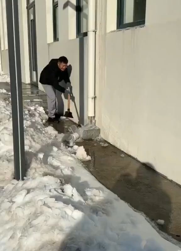 This Removing of Ice From a Downspout