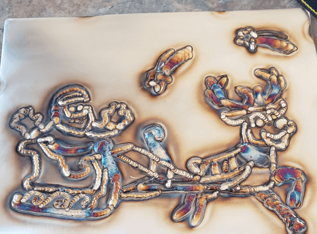 This Santa is drawn completely on metal with a welder