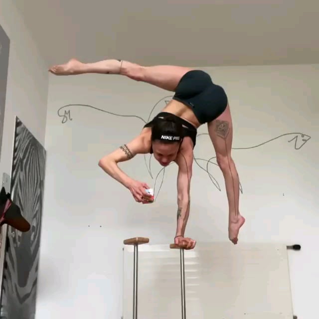 This is Stefanie Millinger, a hand balancer from Austria who holds the world record for the most press handstands in a row (342).