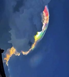 This is an example of an iridescent cloud. It’s created when light is scattered across tiny uniform droplets of water or ice pellets in the atmosphere