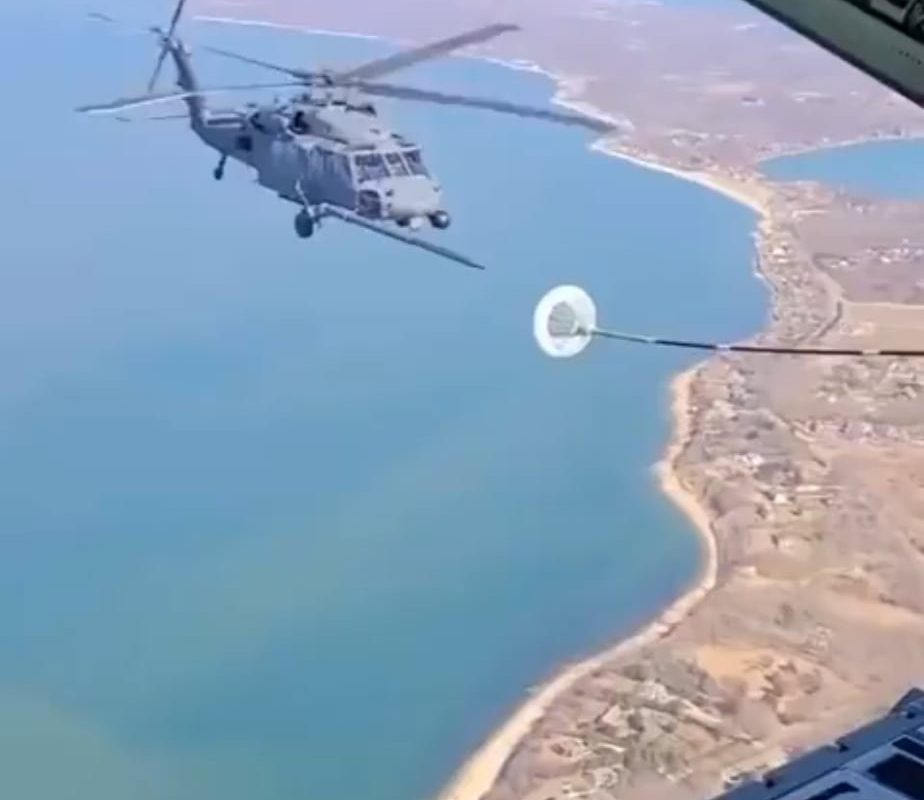 This is how helicopters refuel in midair.