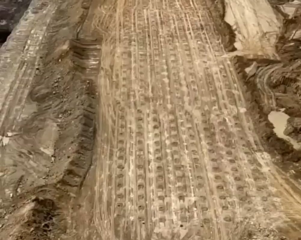 This is rock blasting. A method of breaking down large volumes of rock using controlled explosions. 💥