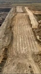 This is rock blasting. A method of breaking down large volumes of rock using controlled explosions. 💥