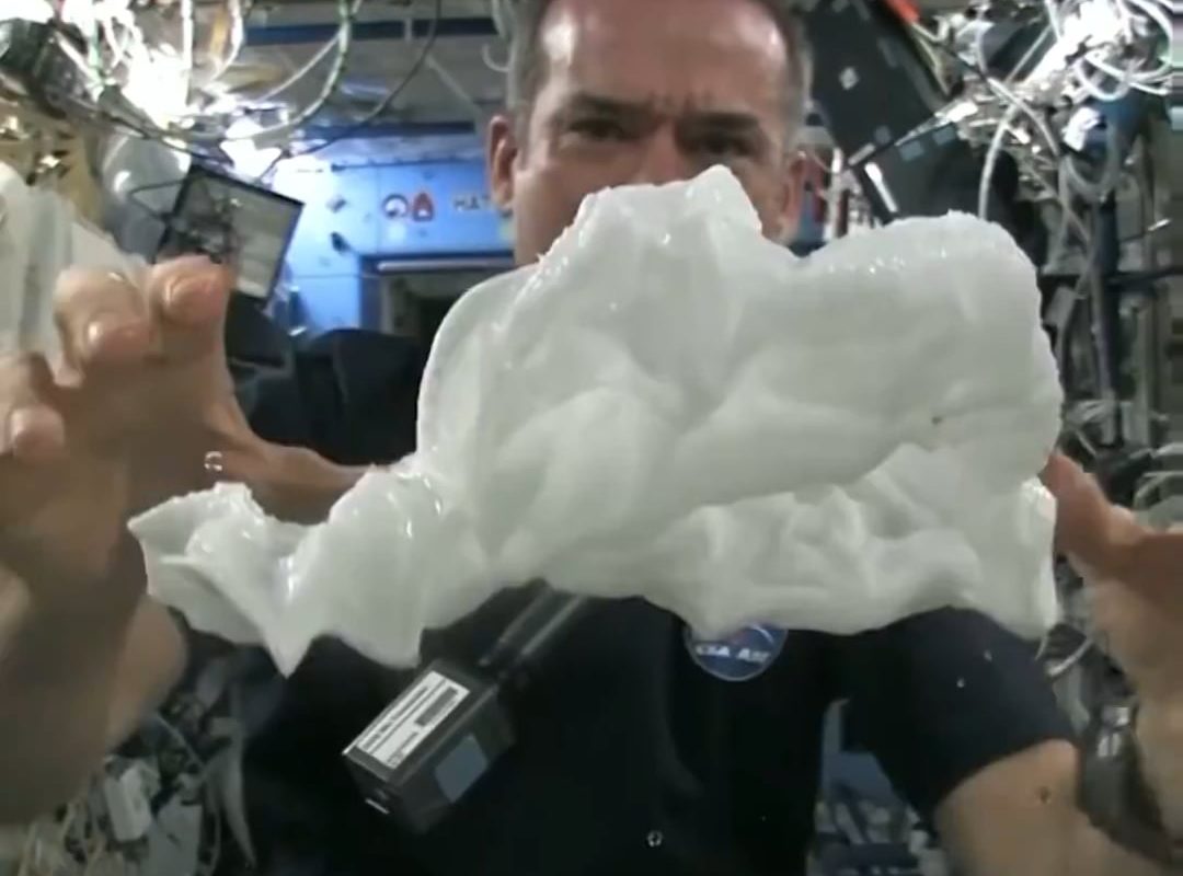 This is what happens when you squeeze out a wet towel in space.