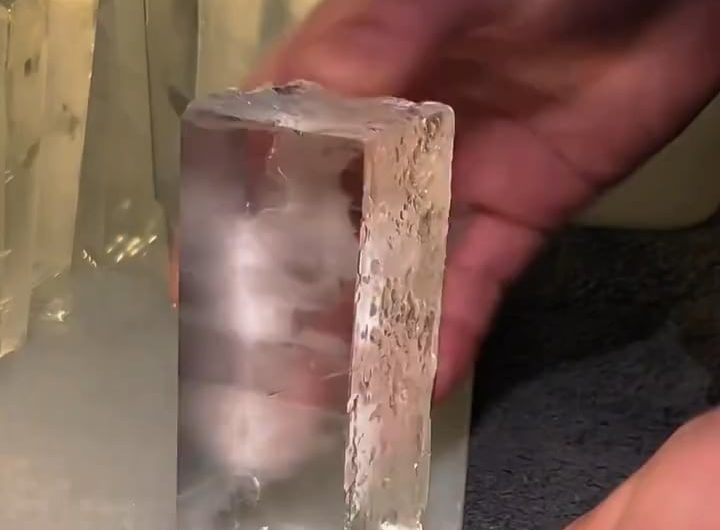 This man cutting ice