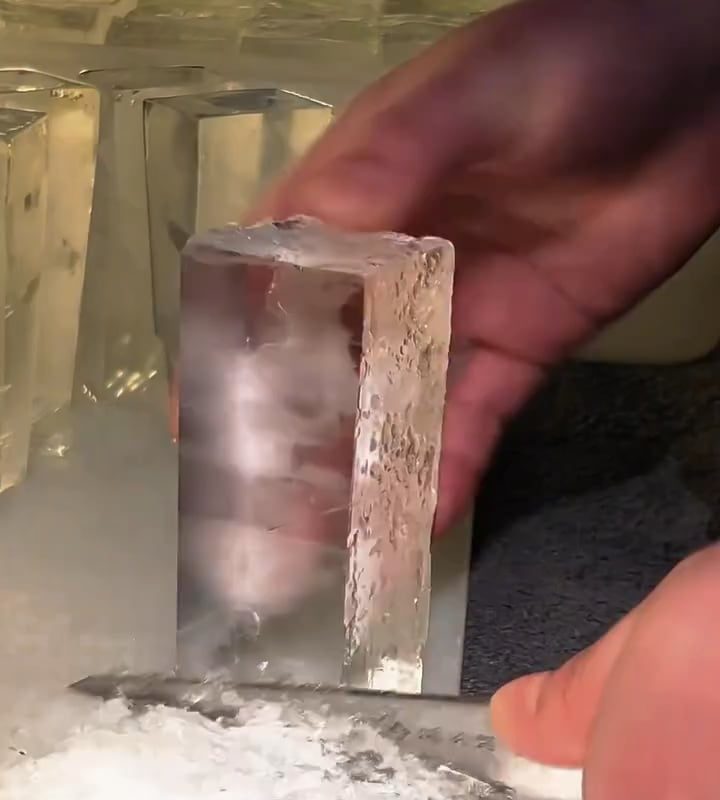 This man cutting ice