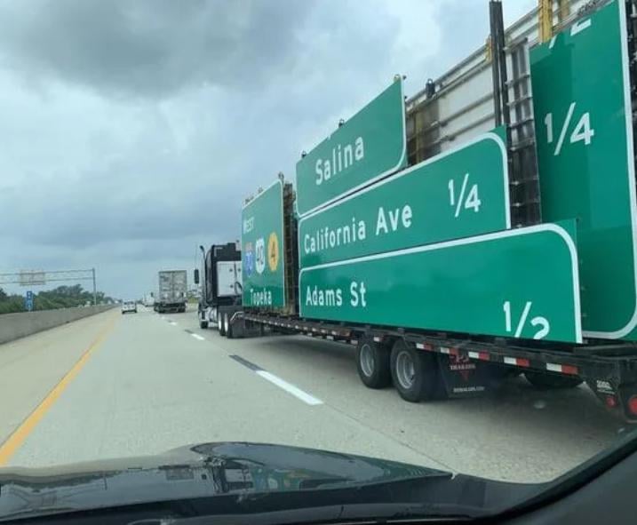 This truck is carrying the signs you see on the interstate