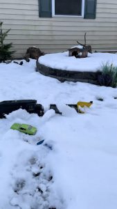 Toy train plowing the snow from its tracks