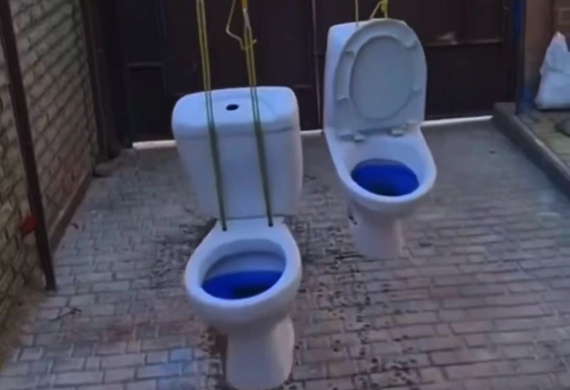 Two swinging commodes