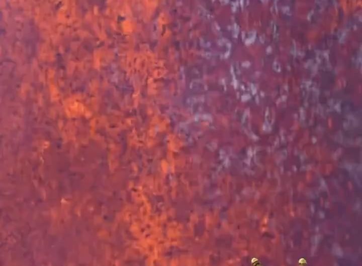 USGS scientists during Kīlauea’s Episode 40 eruption on Jan 12, 2026, by photographer Travis Morrin