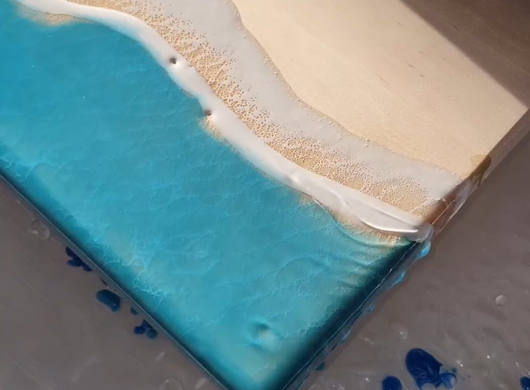 Using a blower to design waves on a resin serving board