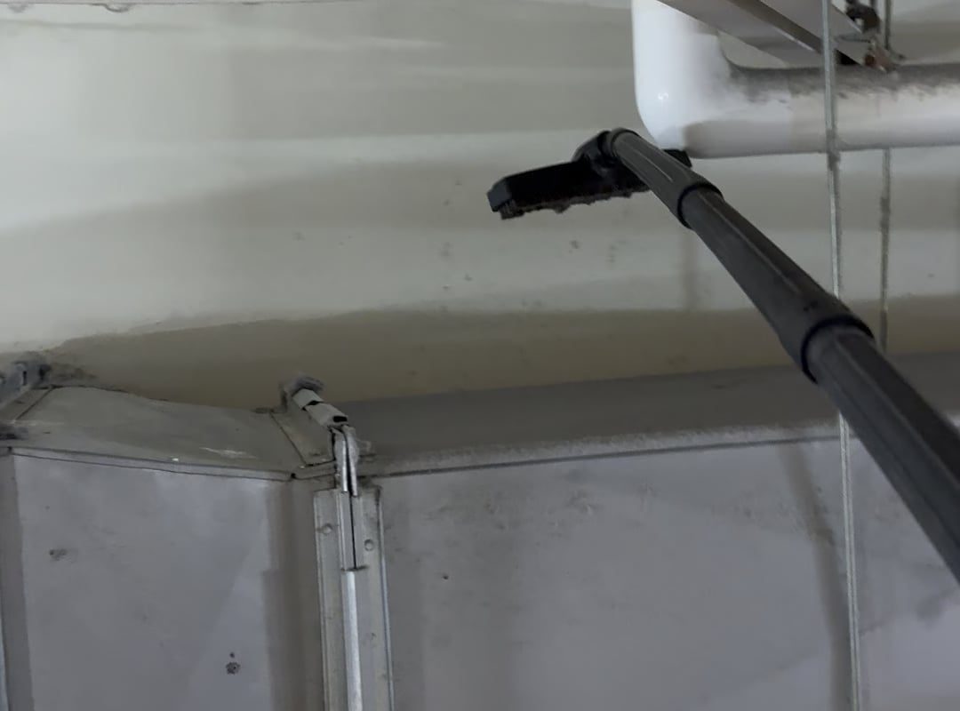 Vacuuming 5 year layer of dust off AC ductwork