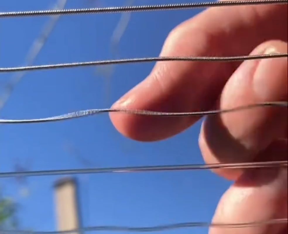 Watching a guitar being played from the sound hole.