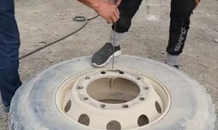 Water bottle balancing in a jet of air releasing from a tyre