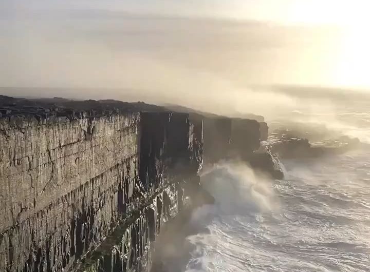 Waves crashing against the cliffs of Inis Meáin, Ireland