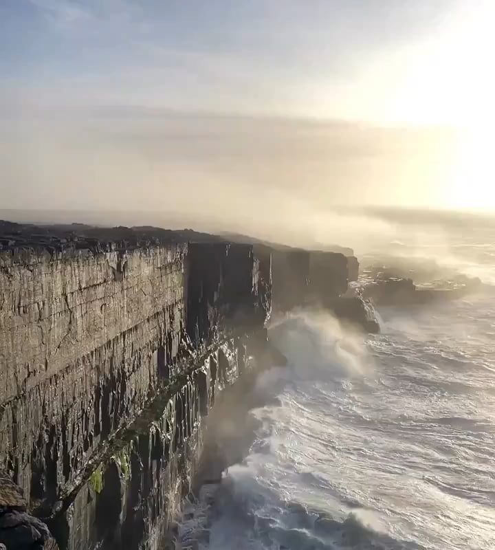 Waves crashing against the cliffs of Inis Meáin, Ireland