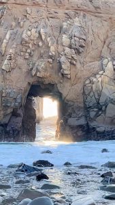 Waves crashing through Keyhole Arch, California