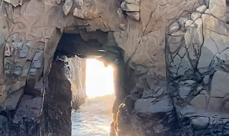 Waves crashing through Keyhole Arch, California