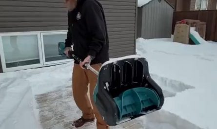 clearing a thick layer of snow on the ground